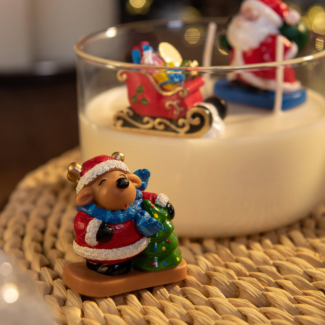 Reindeer with Christmas tree wax figure in holiday candle, handmade festive wax decoration for Christmas centerpiece