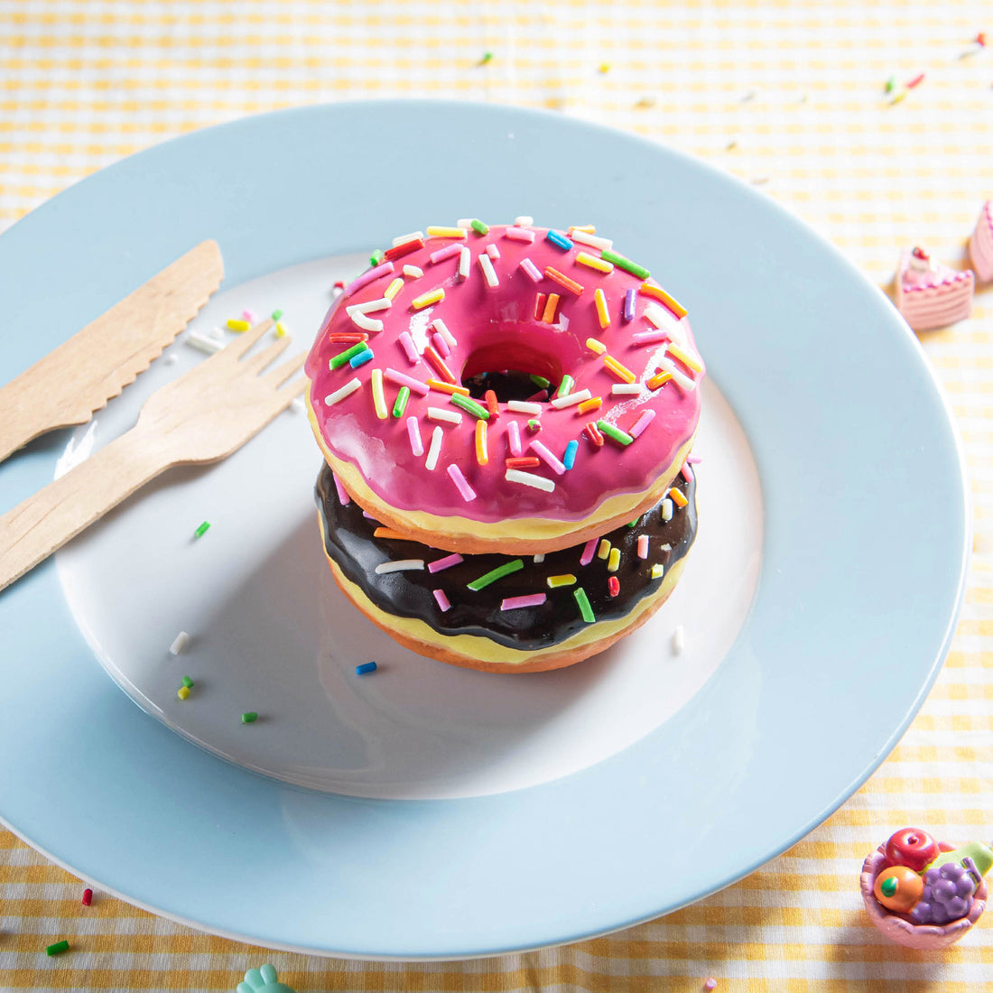 Stacked doughnut candle wax melts with pink frosting and chocolate frosting. Handmade dessert candle for unique food décor and playful gift ideas.
