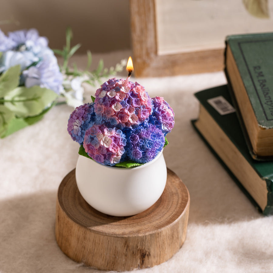 Close-up of hand-carved hydrangea petals in gradient purple tones, highlighting the realistic bloom design — a handcrafted soy wax candle perfect for floral home decoration and gifting.