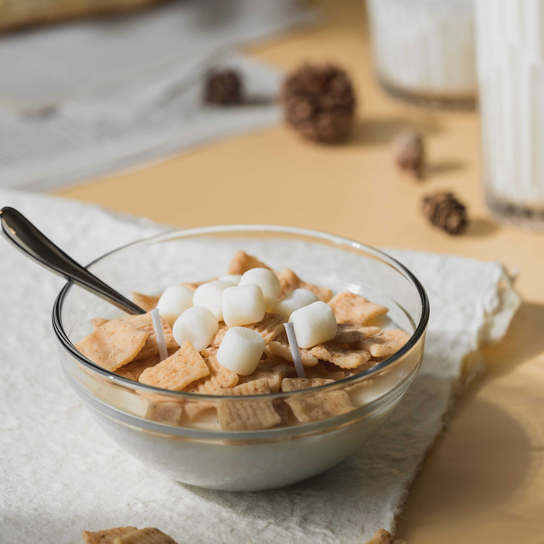 Providing light with this Spun Sugar Cinnamon Cereal Bowl Candle.