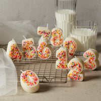 A Colorful Sprinkle Candy Embedded Birthday Number Candle from Southlalke Gifts.