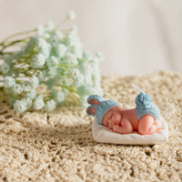 Bring the warmth of home with Sleeping Baby Blue Candle from Southlake Gifts.