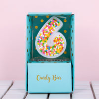 A candy bar box number 6 candle that will brighter than your future.