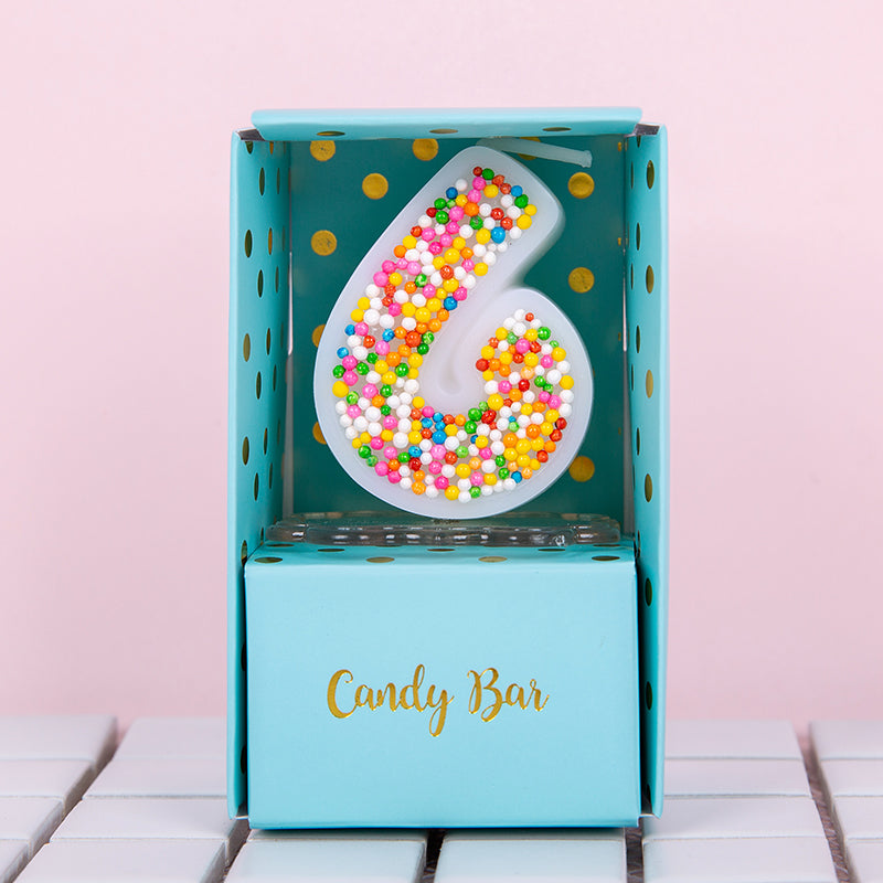A candy bar box number 6 candle that will brighter than your future.