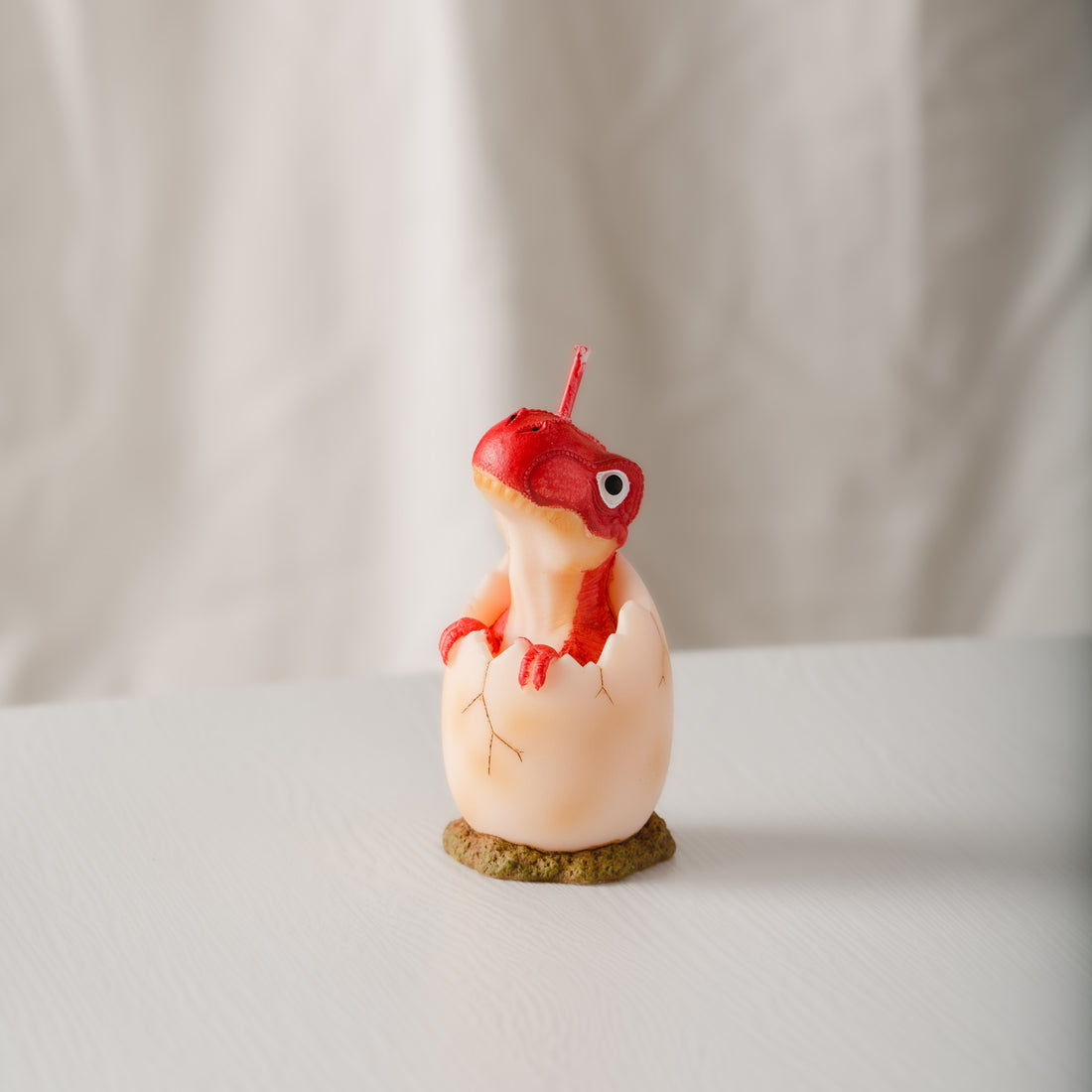 Discover the power of fragrance with this Red Baby Dinosaur Candle.