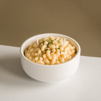 Southlake Gifts Macaroni & Cheese Pasta Candle on a clean white tabletop — realistic butter cheese candle bowl made from soy wax, ideal for gifting during holidays, birthdays, or housewarmings.