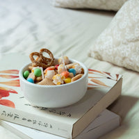 White bowl-shaped candle styled like a snack mix with popcorn and pretzel wax melts, hand-poured by Southlake Gifts — a fun artisan gift for candle fans and a total unique novelty candle gifts