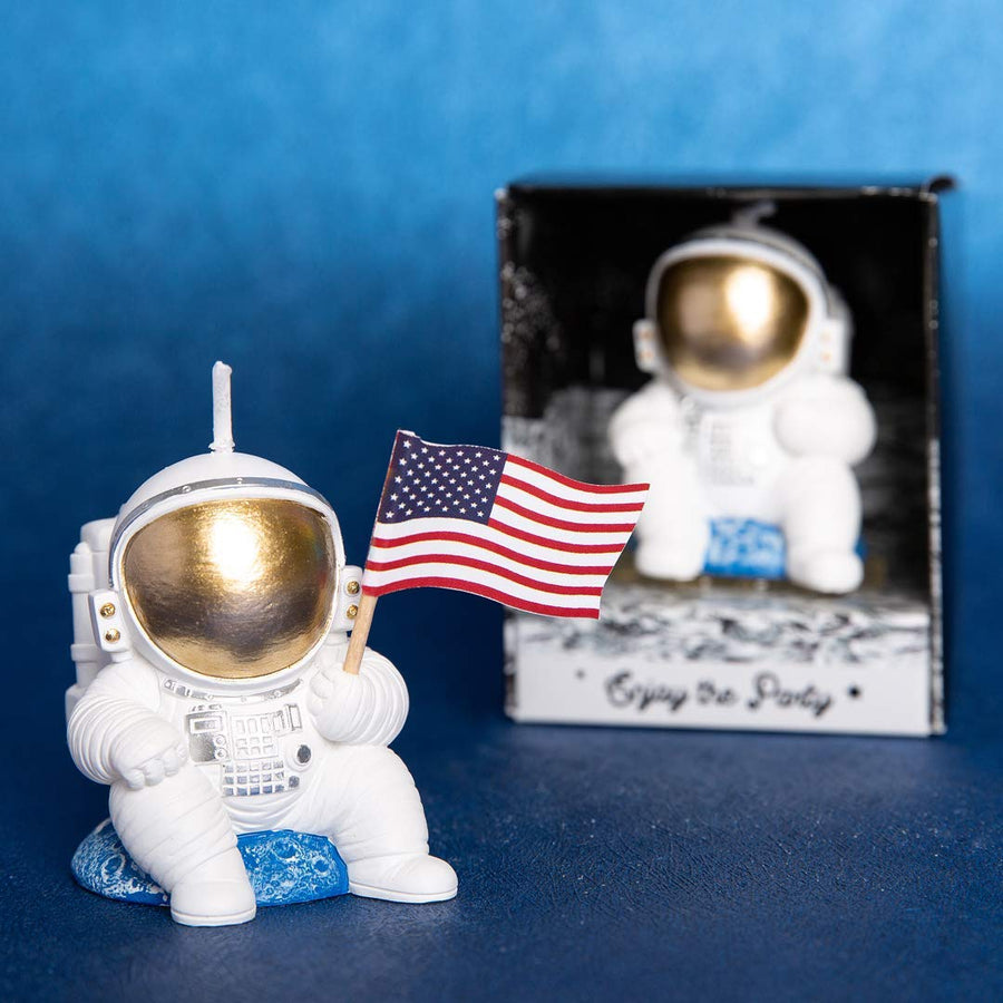 Relax and unwind with this cute Spaceman holding a US Flag Candle.